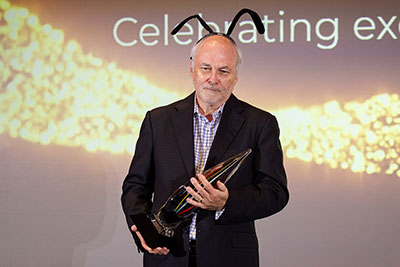 Still in his pollinator costume from the company's Spirit Award effort, Bill Cobb accepts the Corporate Conservation Leadership Award for Freeport.